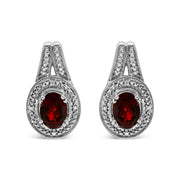 Bids.com .925 Sterling Silver Diamond Accent and 8x6mm Red Oval Garnet Stud Earrings (I-J Color, I1-I2 Clarity) Earrings White Smoke White.Sterling Silver / 0.048