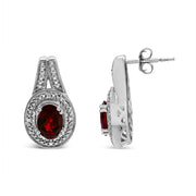 Bids.com .925 Sterling Silver Diamond Accent and 8x6mm Red Oval Garnet Stud Earrings (I-J Color, I1-I2 Clarity) Earrings White Smoke White.Sterling Silver / 0.048