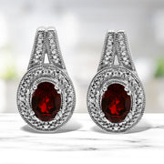 Bids.com .925 Sterling Silver Diamond Accent and 8x6mm Red Oval Garnet Stud Earrings (I-J Color, I1-I2 Clarity) Earrings White Smoke White.Sterling Silver / 0.048