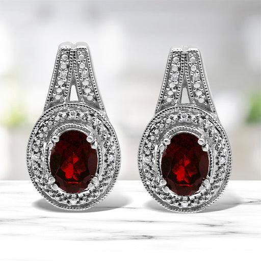 Bids.com .925 Sterling Silver Diamond Accent and 8x6mm Red Oval Garnet Stud Earrings (I-J Color, I1-I2 Clarity) Earrings White Smoke White.Sterling Silver / 0.048