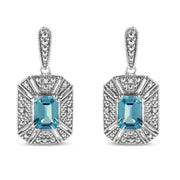 Bids.com .925 Sterling Silver 7x5MM Emerald Shape Blue Topaz and Diamond Accent Art Deco Halo Style Drop and Dangle Earrings (I-J Color, I1-I2 Clarity) Earrings White Smoke White.Sterling Silver / 0.04