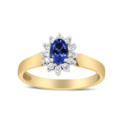 Bids.com 14K Yellow Gold 1/5 Cttw Round Diamond and 6x4mm Oval Blue Tanzanite Halo Ring (H-I Color, I1-I2 Clarity) - Size 7.75 Rings White Smoke 7.75 / Yellow.Gold