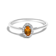 Bids.com 10K White Gold 5X3MM Oval Purple Amethyst and Diamond Accent Halo Ring (I-J Color, I1-I2 Clarity) - Ring Size 6.5 Rings White Smoke 6.5 / White.Gold / Orange Citrine,5 / White.Gold / Orange Citrine,5.5 / White.Gold / Orange Citrine,6 / White.Gold / Orange Citrine,7 / White.Gold / Orange Citrine,7.5 / White.Gold / Orange Citrine,8 / White.Gold / Orange Citrine