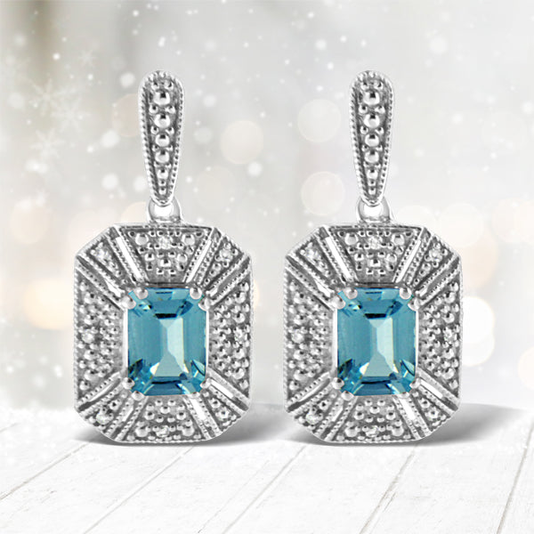 Bids.com .925 Sterling Silver 7x5MM Emerald Shape Blue Topaz and Diamond Accent Art Deco Halo Style Drop and Dangle Earrings (I-J Color, I1-I2 Clarity) Earrings White Smoke White.Sterling Silver / 0.04