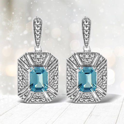 Bids.com .925 Sterling Silver 7x5MM Emerald Shape Blue Topaz and Diamond Accent Art Deco Halo Style Drop and Dangle Earrings (I-J Color, I1-I2 Clarity) Earrings White Smoke White.Sterling Silver / 0.04