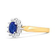 Bids.com 14K Yellow Gold 1/5 Cttw Round Diamond and 6x4mm Oval Blue Tanzanite Halo Ring (H-I Color, I1-I2 Clarity) - Size 7.75 Rings White Smoke 7.75 / Yellow.Gold