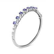Bids.com 14K White Gold 5 MM Oval Blue Tanzanite and 1/4 Cttw Diamond Bangle (H-I Color, VS2-SI1 Clarity) - Fits wrists up to 7 1/2 Inches Bracelets White Smoke White.Gold / 7