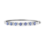 Bids.com 14K White Gold 5 MM Oval Blue Tanzanite and 1/4 Cttw Diamond Bangle (H-I Color, VS2-SI1 Clarity) - Fits wrists up to 7 1/2 Inches Bracelets White Smoke White.Gold / 7