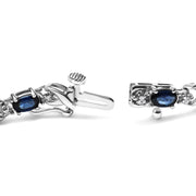 Bids.com 10K White Gold 5x4mm Oval Sapphire Gemstone and 1/10 Cttw Diamond Prong Set "X" Link Bracelet - Size 7" (H-I Color, SI1-SI2 Clarity) Bracelets White Smoke White.Gold / 7