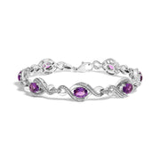 Bids.com .925 Sterling Silver 1/10 Cttw Natural Round Diamond and 7X5MM Oval Amethyst Cross Tennis Bracelet (I-J Color, I1-I2 Clarity) - 7" Bracelets White Smoke White.Sterling Silver / 7