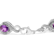Bids.com .925 Sterling Silver 1/10 Cttw Natural Round Diamond and 7X5MM Oval Amethyst Cross Tennis Bracelet (I-J Color, I1-I2 Clarity) - 7" Bracelets White Smoke White.Sterling Silver / 7