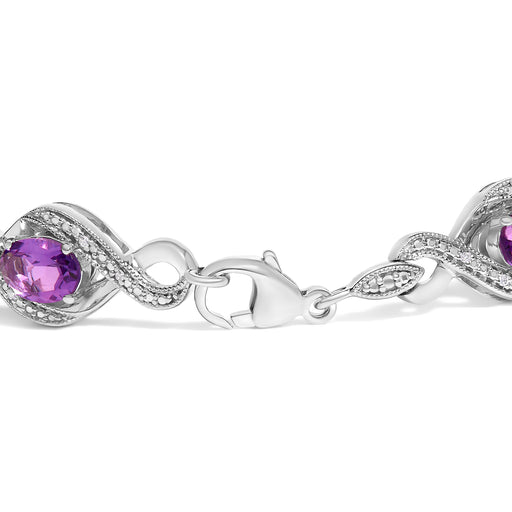 Bids.com .925 Sterling Silver 1/10 Cttw Natural Round Diamond and 7X5MM Oval Amethyst Cross Tennis Bracelet (I-J Color, I1-I2 Clarity) - 7" Bracelets White Smoke White.Sterling Silver / 7