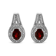 Bids.com .925 Sterling Silver Diamond Accent and 8x6mm Red Oval Garnet Stud Earrings (I-J Color, I1-I2 Clarity) Earrings White Smoke White.Sterling Silver / 0.048